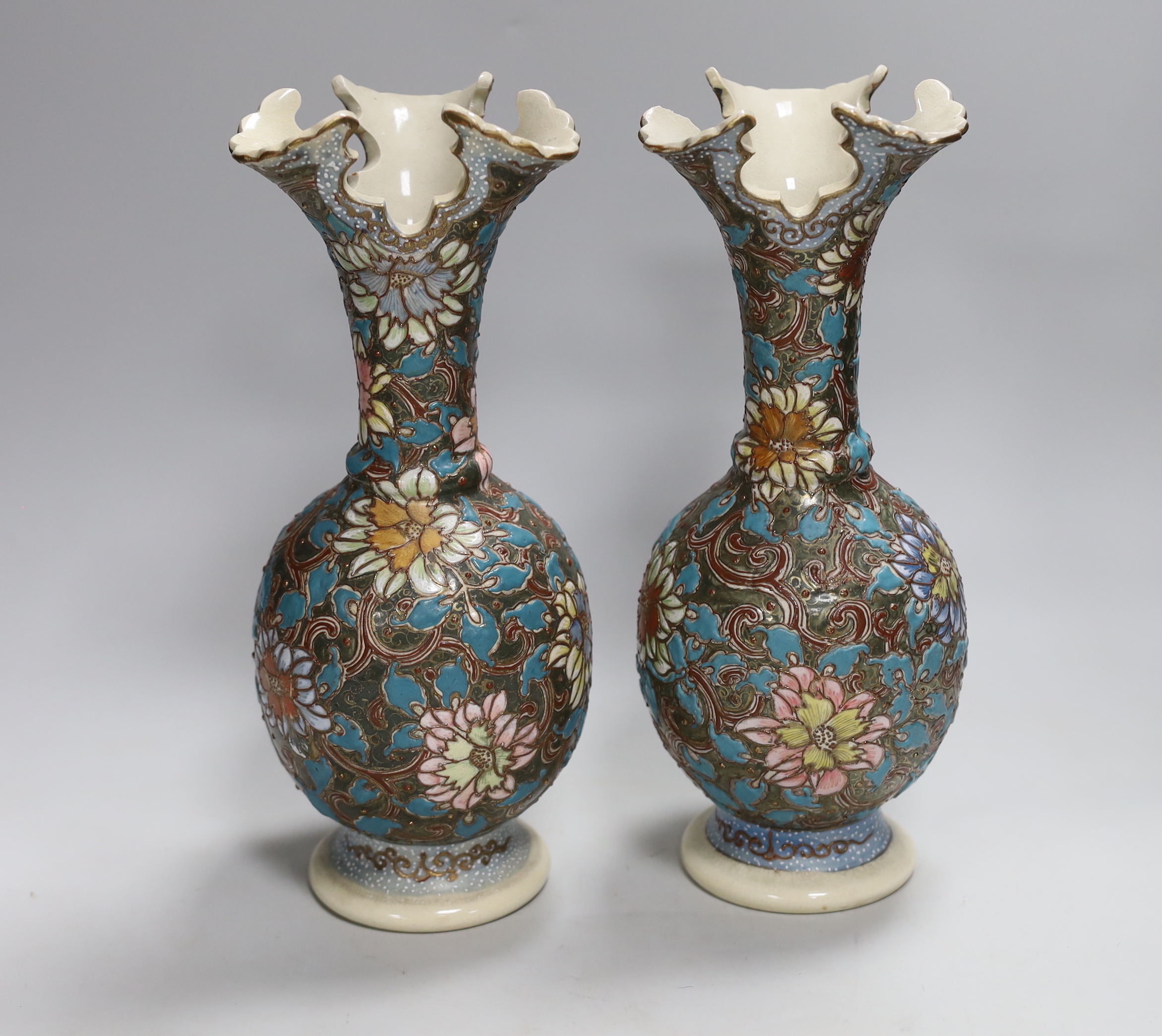 A pair of Japanese moriage pottery vases, 30cm high